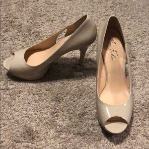 Nude patent leather peep toe heels